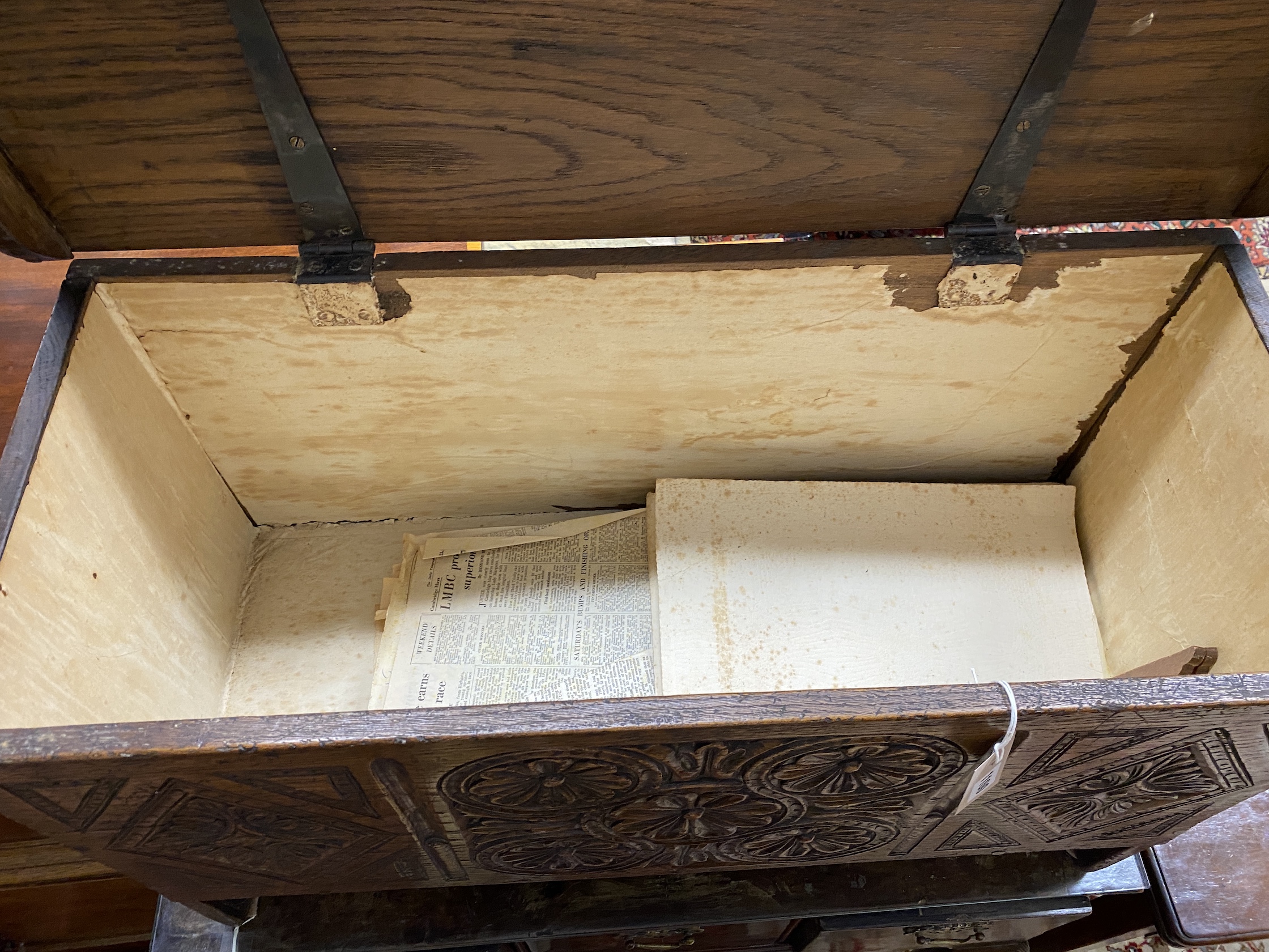 A 17th century style “Sussex” oak six plank coffer with a carved front, width 85cm, depth 36cm, height 51cm